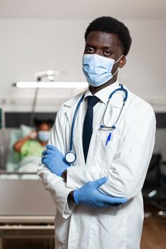 Portrait of african american practitioner doctor with protective face mask