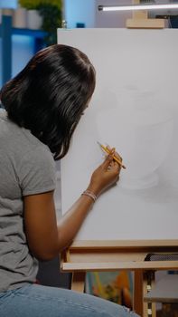 African american woman with artist occupation drawing