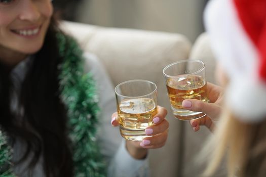 Friends drink alcoholic cocktails and celebrate new year together