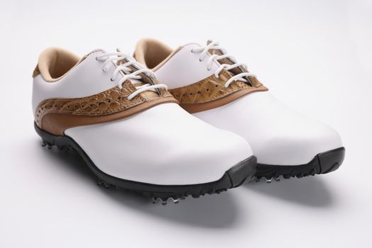 Pair of stylish fashionable shoes with unique design, white leather combines with gold