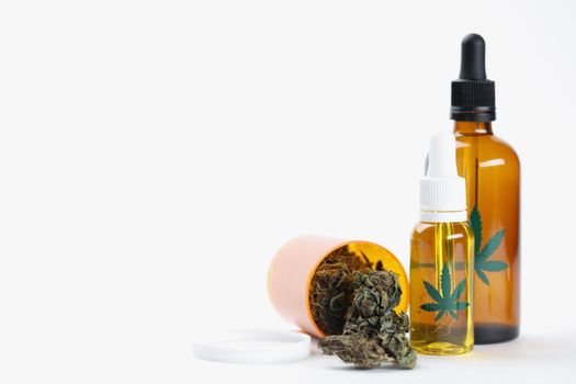 Dry marijuana buds extract oil and spray presented in bottle