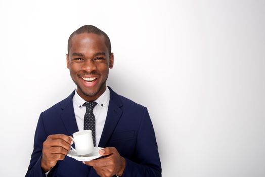 happy african american businessman holding cup of coffee