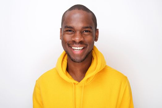 Close up happy african american man in hoodie by white background