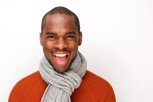 african american man smiling with scarf against white background