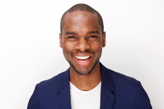 front portrait of handsome black man smiling against isolated white background