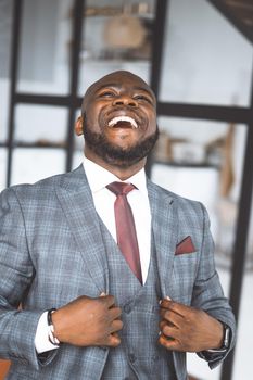 Happy Laughing Rich African American Businessman. Successful Media Tycoon In Stylish Expensive Suit. Concept Of Rich Life, Successful