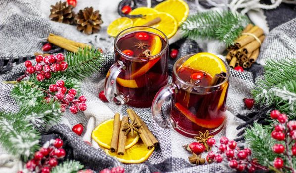 hot mulled wine on a wooden table. New year concept