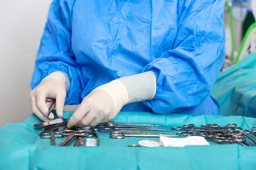 Nurse prepare medical instruments for surgery