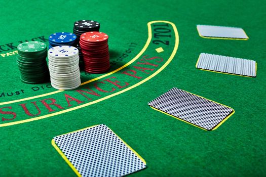 Casino chips and cards on casino table, poker game concept