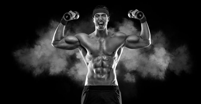 Happy man athlete with dumbbell on black background. Gym full body workout. Muscular man athlete in fitness gym have havy workout. Sports trainer on trainging. Fitness motivation.