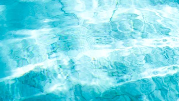 water swimming pool texture and surface water on pool, reflection blue wave nature water on the outdoor swimming pool