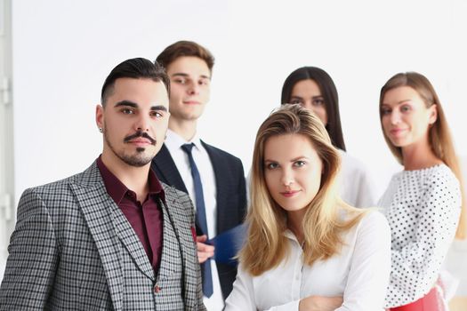 Smart confident team of successful people, coworkers pose for collective picture