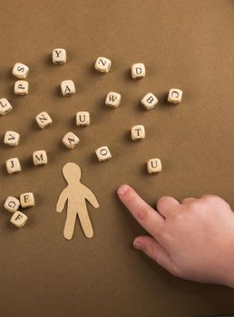 Wooden letter cubes   and man figurine