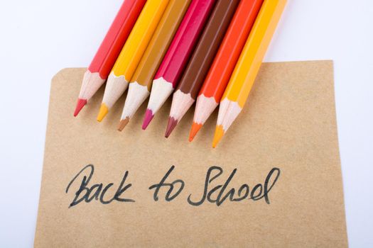 Color pencils and back to school title 