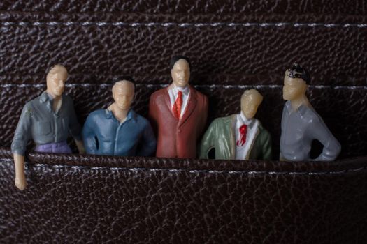 Tiny figurine of men model  in pockets