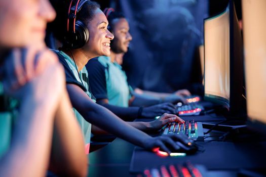 Cybersport team participating in online tournament in gaming club