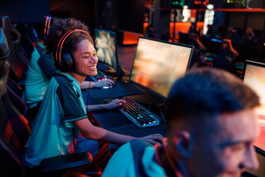Young gamers participating in esports tournament in gaming club
