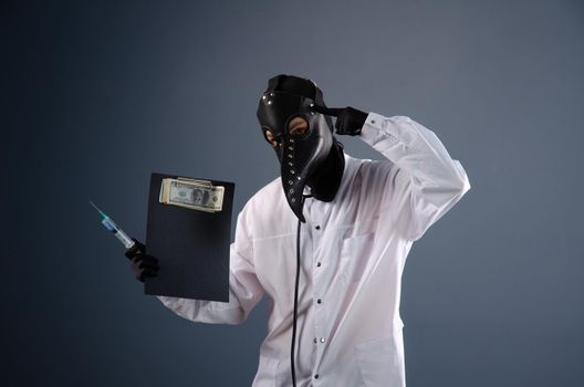 doctor in a dressing gown, in a plague doctor's mask, is vaccinating