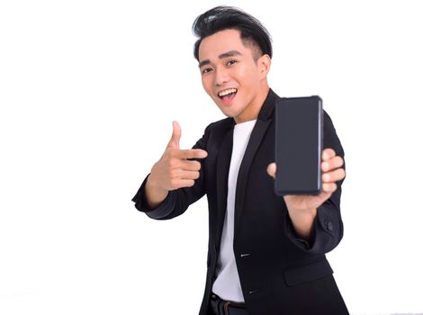 Happy Business man holding  smartphone in hand  and pointing at device