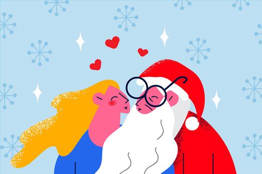 Santa Claus kiss smiling young woman