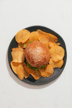 still life with fast food hamburger menu, french fries and ketchup
