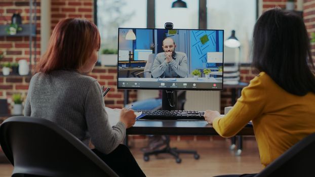 Team of people recruiting candidate on video call job interview