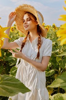 woman portrait in a field of sunflowers lifestyle landscape. High quality photo