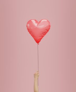 heart shaped balloon held by a hand