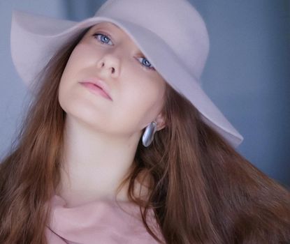 Retro film look and fashion accessory concept. Beautiful brunette woman with long hairstyle wearing pink hat as classic glamour style and chic vintage portrait