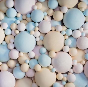 Abstract 3d Background With Pastel Colors Matte Balls. Delicate Blue, Pink, Beige Balls Different Sizes of Spherical Shape. Texture Background. Close-up