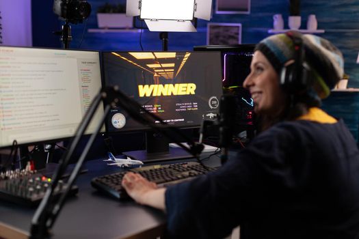Player winning video games on live stream with chat