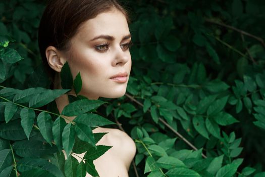 attractive woman green leaves clean skin nature summer close-up