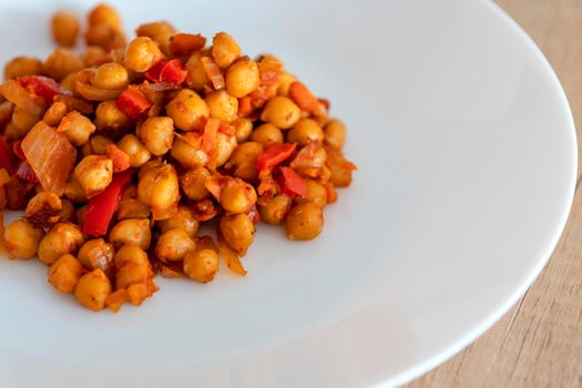 cooked beans on a plate, vegetarian dish, cooked chickpeas, vegetarianism concept, diet food, close-up