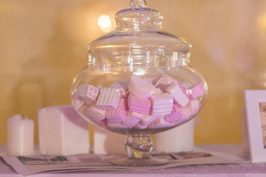 White and pink marshmallows in a jar