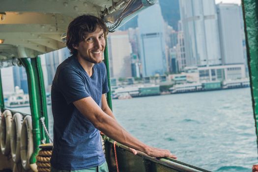 A young man on a ferry in Hong Kong