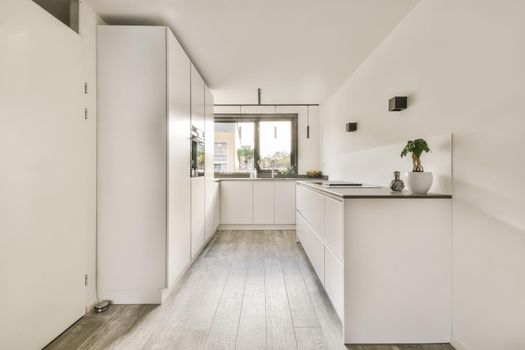 Snow-white kitchen set with dark countertop