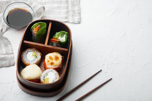 Japanese bento lunch box with chopsticks, on white stone background , with copyspace and space for text