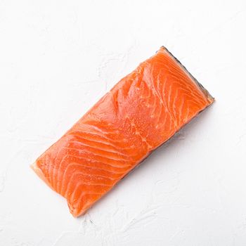 Salmon. Fresh raw salmon fish fillet, square format, on white stone table background, top view flat lay, with copy space for text
