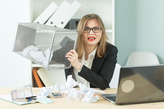 Stress, office, hysteric, people concept - aggressive woman with a lot of work in office laugh because of hysteric