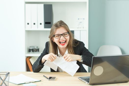 Stress, office, hysteric, people concept - aggressive woman with a lot of work in office laugh because of hysteric