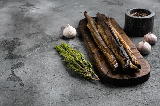 Smoked Lamprey seafood delicacy , on gray stone table background, with copy space for text