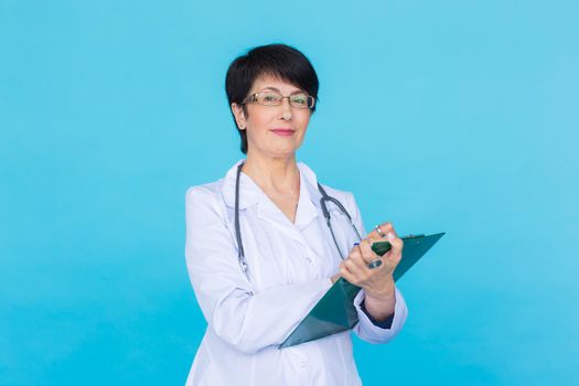 Medical physician doctor woman over blue background