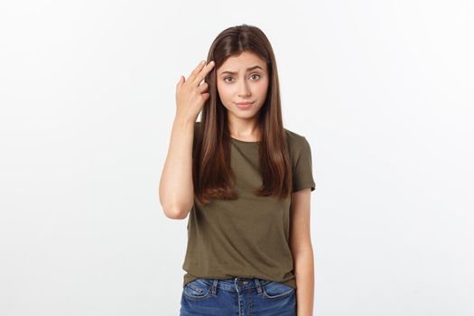 Girl with a suspicious look and hand on her side on a white isolated background.