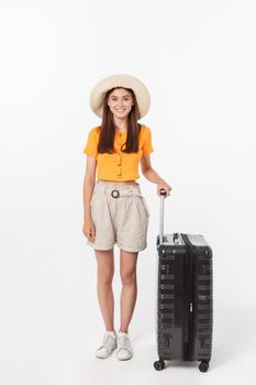 Woman tourist. Full length happy young woman standing with suitcase with exciting gesturing, isolated on white background.