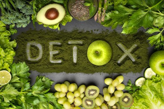 Detox diet, clean and healthy eating. Top view of fresh vegetables, fruits and chlorella with detox text