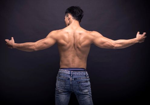 Rear view of  muscular young man