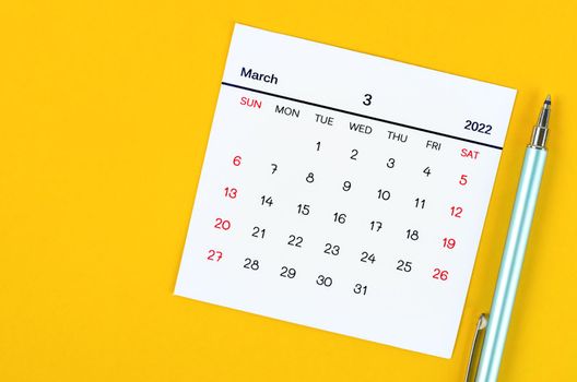 March 2022 calendar on yellow background.