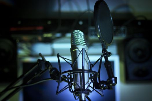 Announcer microphone on recording studio background