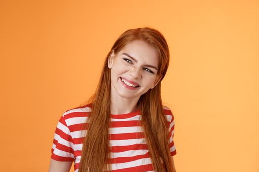 Sassy confident redhead daring girl have perfect summer plans, vacation ideas, inspired create something awesome, wrinkle nose excited, smiling satisfied look left assured, satisfied expression