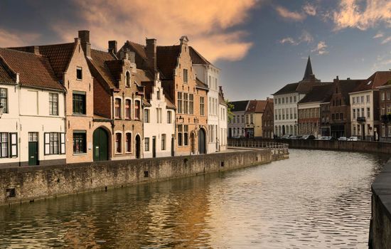 Street in the medieval Belgian city of Bruges at sunset.